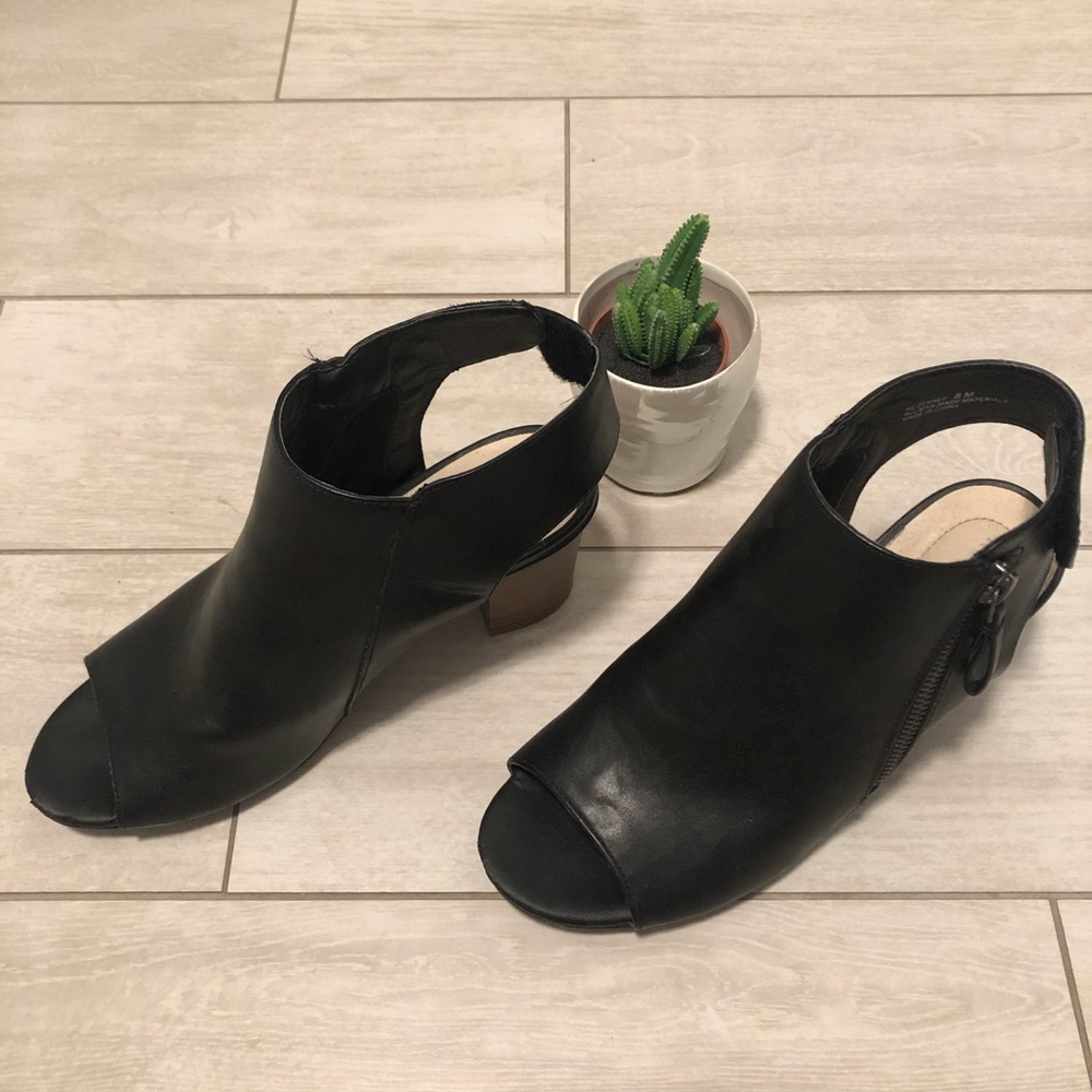 Black heeled open toe booties